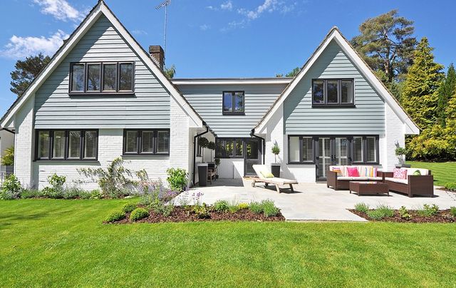 Bright two-storey home with lap siding and a landscaped yard