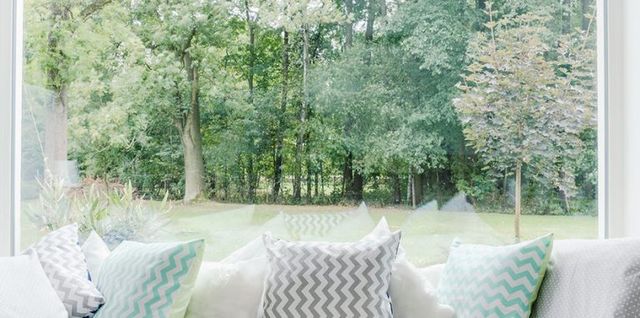 Large picture window looking out over a green yard